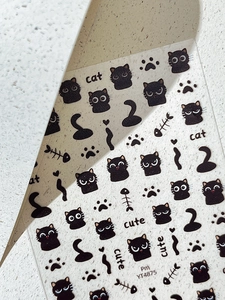 Close-up of YT4875 cute black cat nail stickers featuring fish bones and paw prints