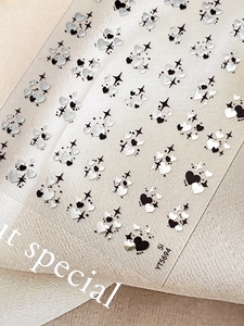 Detail of embossed heart and star nail art stickers with silver laser finish on YT5694