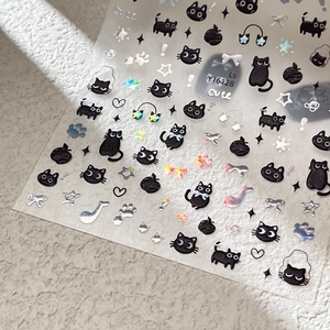 3D embossed nail stickers featuring cute black cats and music notes on textured background