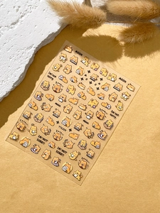 Detail of cute embossed cartoon dog and cat nail stickers on a transparent sheet