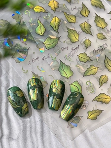 Detail of laser green leaf nail stickers with metallic flash effect and wear display