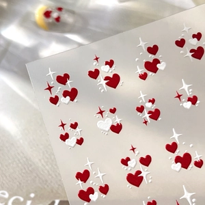 5D embossed nail art stickers featuring red and white hearts and sparkles for manicure
