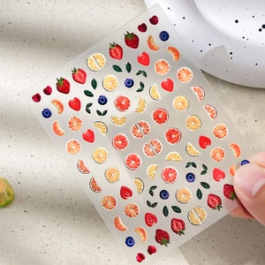 3D embossed fruit nail stickers featuring 3D strawberry and orange designs for summer DIY art