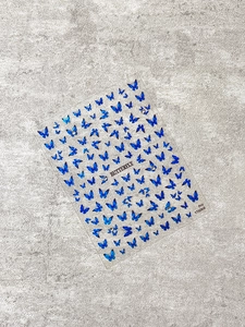Detail of YT6068 blue butterfly nail stickers with holographic laser glitter effect