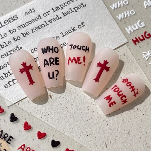 Matte press-on nails with red cross and street style lettering on nude base