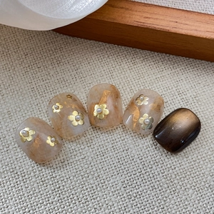 Short square amber cat eye press-on nails with gold foil and dainty floral accents