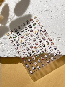 Cute cartoon bunny nail stickers with colorful red blue and yellow trendy rabbit patterns