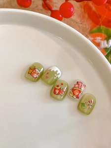 Short round fake nails with festive red envelopes and fireworks on matcha green base