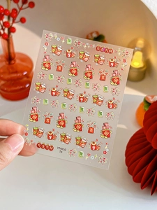 Detail of YT4650 nail stickers with Chinese New Year motifs like red envelopes and fireworks