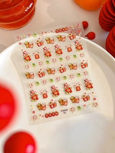 Detail of Lunar New Year nail stickers with red envelopes, fireworks and lucky motifs