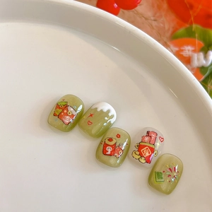 Short square Chinese New Year nail set in matcha green and cream with festive hand-painted art