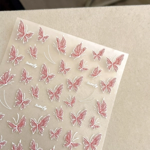 Pink butterfly nail art stickers with 3D embossed texture and white outline details