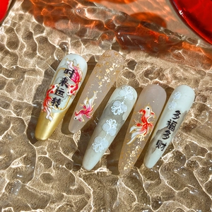 Oriental nail art stickers featuring koi fish, gold foil, and lucky calligraphy designs