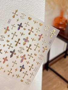 Macro detail of gothic cross and heart nail stickers with gold laser effect, model YT4376