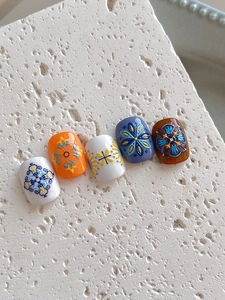 Macro shot of Bohemian 5D embossed nail art stickers with vintage mandala floral patterns