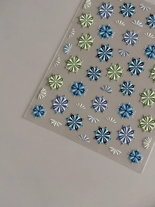 Detail view of 5D embossed bohemian nail stickers with snowflake and floral patterns