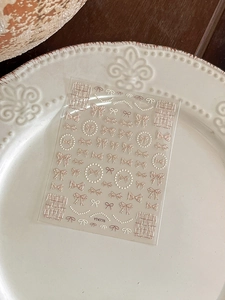 Detail of YT4776 nail art stickers with rose gold bows and pearl chain designs