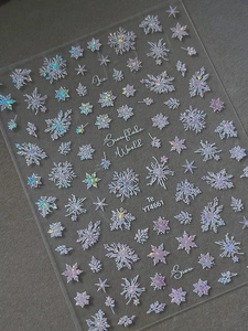 Macro view of iridescent laser snowflake nail stickers with holographic rainbow shine