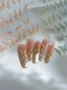 Detail of Butterfly Dream nail art decals with gold gilding and translucent 3D wing effects