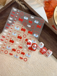 Detail of 3D embossed nail stickers with cute apple, bow, and flower patterns