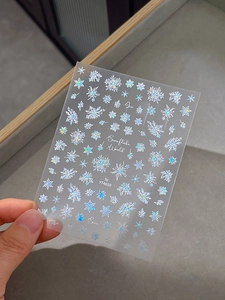 Macro shot of laser holographic snowflake nail stickers with YT4659 design elements