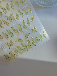 Detail of Butterfly Dream YT4899 nail stickers with gold embossed edges and green tint