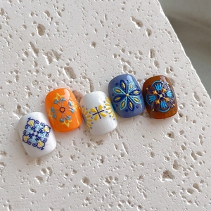 Bohemian embossed nail stickers with intricate mandala patterns on multicolor base colors