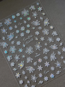 Macro shot of YT4660 holographic snowflake nail stickers with laser glitter effect