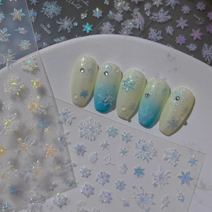 Glittering iridescent snowflake nail art stickers with laser effect and gradient design