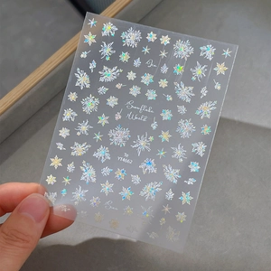 Holographic snowflake nail art sticker with laser sparkle design and adhesive backing