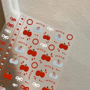3D embossed nail stickers featuring red apples, blue floral motifs and red bows