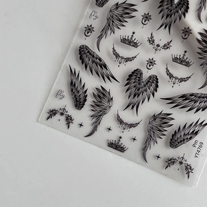 Black minimalist wings and crown nail art stickers with stars and lunar motifs
