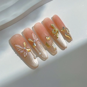 Handmade silver cat-eye press-on nails with 3D butterfly and rhinestone accents