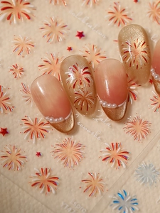 Detail of laser firework nail stickers with 3D cat-eye effect and pearl nail art accents