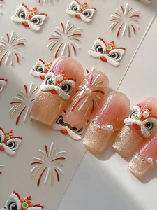 Macro detail of 3D embossed lion dance nail stickers with gold glitter and pearl accents