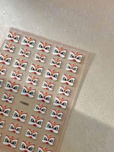 Detail of 3D embossed nail stickers featuring colorful Chinese lion dance YT4846