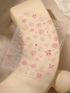 Macro shot of 3D embossed colorful firework nail art stickers with holographic texture