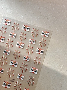 Detailed macro view of 3D embossed Chinese lion dance and firework nail art stickers YT4888