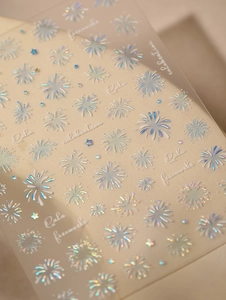 Detailed macro view of laser holographic nail stickers with colorful firework patterns