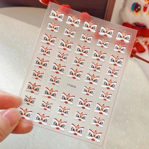 3D embossed lion dance nail art stickers in red and gold colors for festive manicure decoration