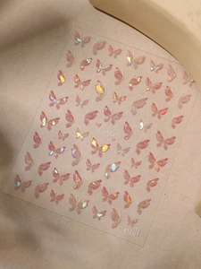 Macro detail of iridescent butterfly nail stickers with pearlescent shell finish YT4561