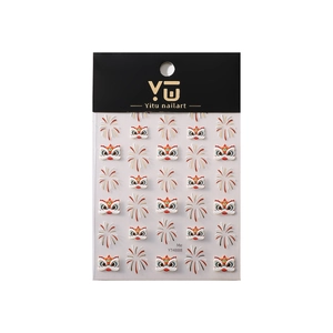 Lion dance and firework nail art stickers with golden accents on a black backing card
