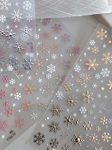 Detail of holographic gold and silver snowflake nail art stickers with product code YT4678