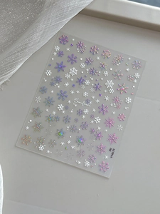 Detail of YT4679 snowflake nail stickers with holographic laser and white metallic finish