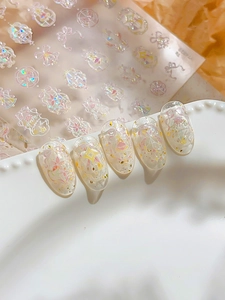Pink bow and star laser nail stickers with iridescent finish on clear false nails
