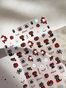 Close-up of 3D embossed nail stickers featuring cute black cats and red apples YT5048