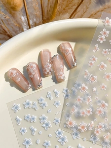 3D relief white and blue floral nail art stickers on pink cat-eye press-on nails