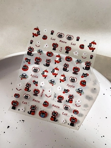 Close-up of YT5048 nail stickers with embossed red apples and cute black cat motifs