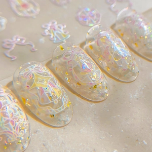 Pink bow nail art stickers with glitter shell finish and sparkling star designs