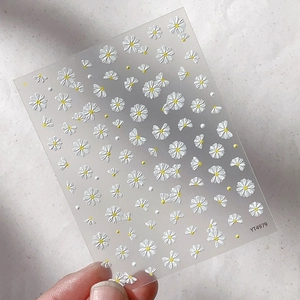 5D embossed daisy nail art stickers with white floral patterns and yellow centers